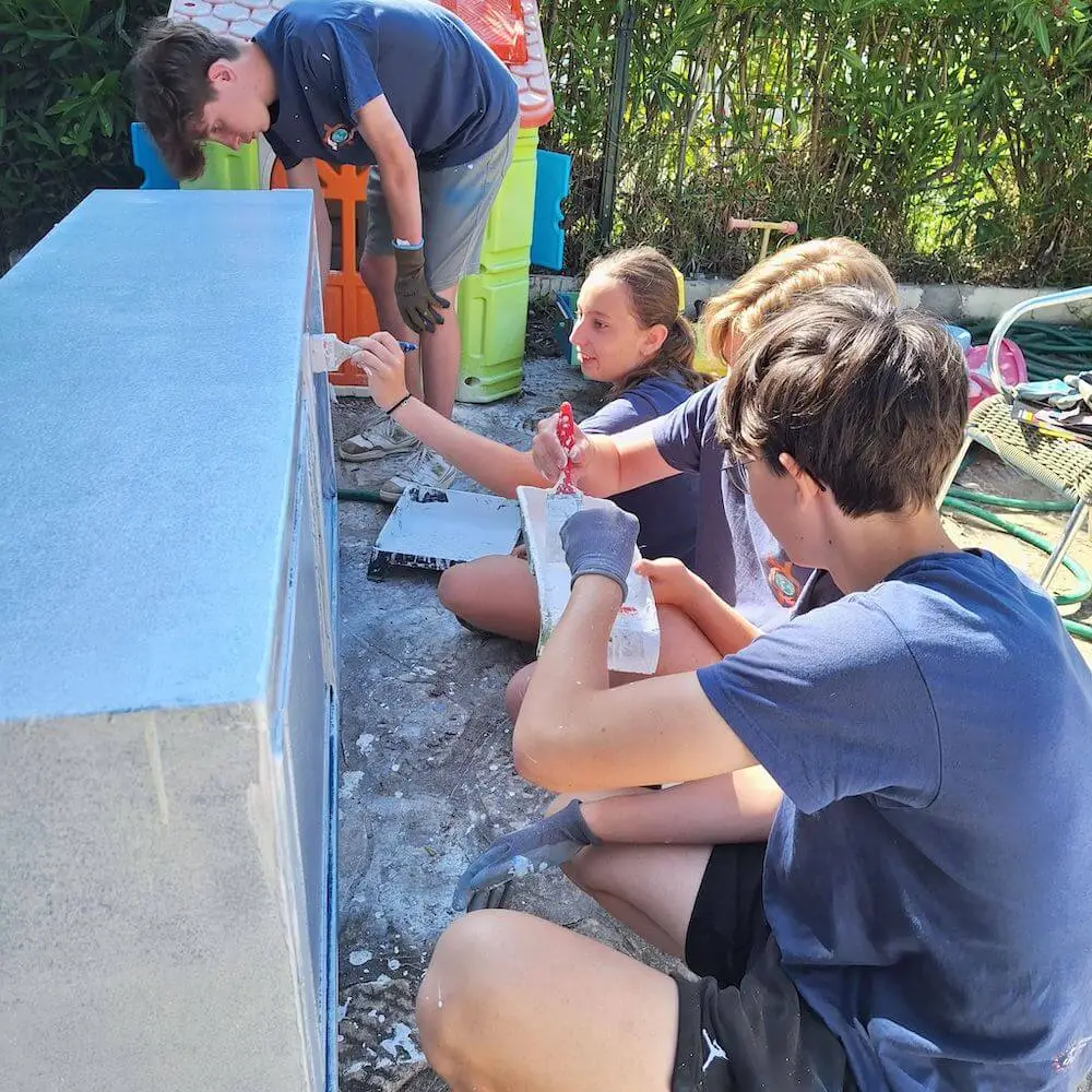 Group of volunteers preparing to work together on a community project abroad