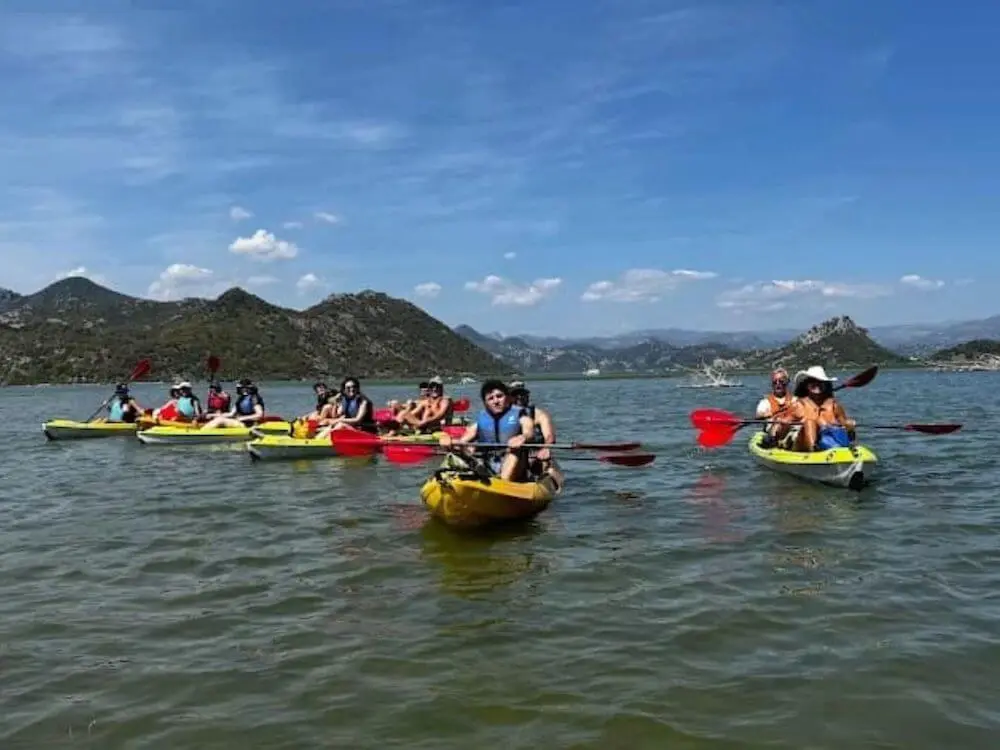 Volunteers kayaking on Lake Skadar in Montenegro, showing the nature-based setting of Abroad Escape’s supported volunteer programs near Godinje.