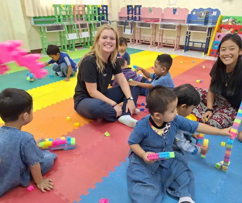 Volunteers working together on a community project abroad