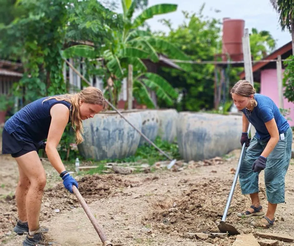 Volunteers working together on a community project abroad
